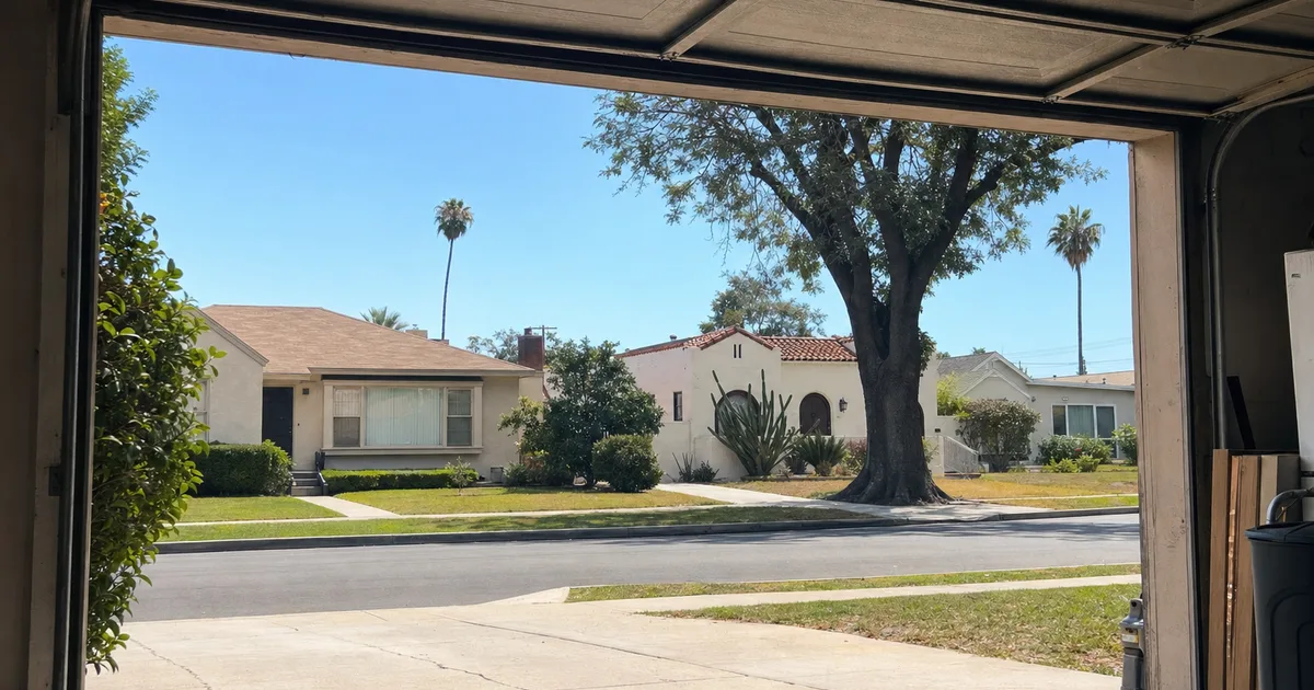 View from inside a garage looking out to a Signal Hill, CA street — same-day garage door repair